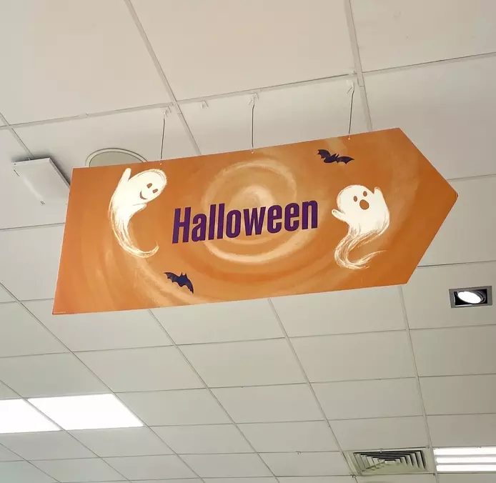 an illustration for Waitrose supermarket, featuring hand illustrated ghosts and bats on an orange background 